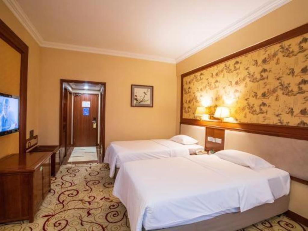 Fenggang Gladden Hotel Tiantangwei Exterior foto